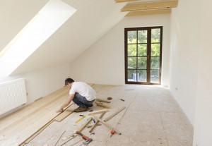 a person installing new wood floors