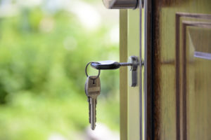 unlocking door of new home